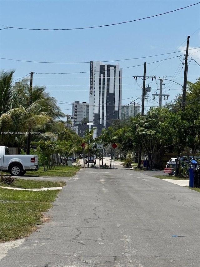 1134 NE 5th Ter, Fort Lauderdale, FL 33304 - view of asphalt street featuring traffic signs