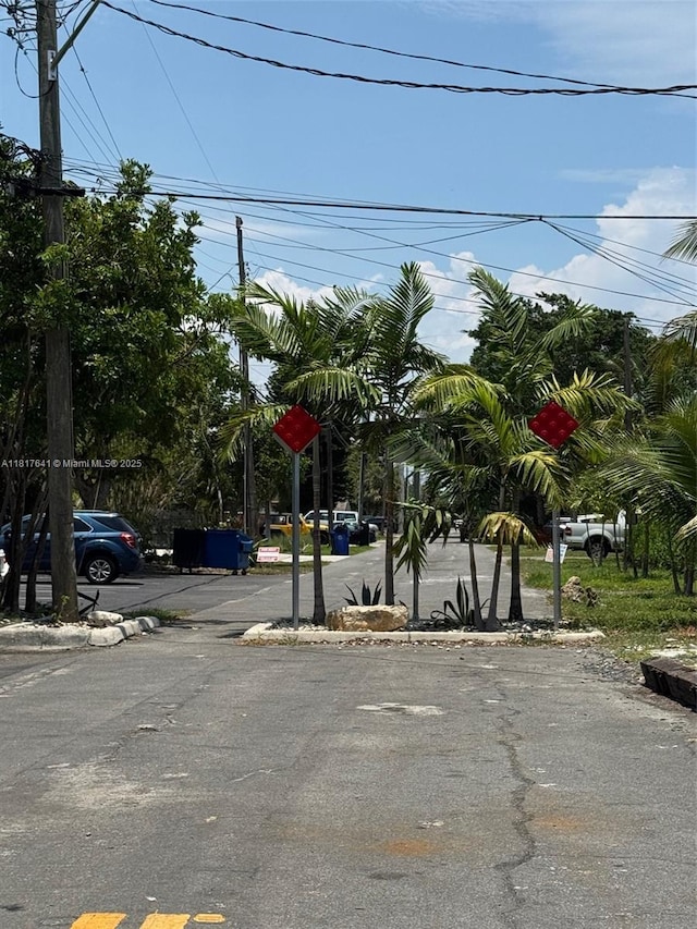 1134 NE 5th Ter, Fort Lauderdale, FL 33304 - view of asphalt road with traffic signs
