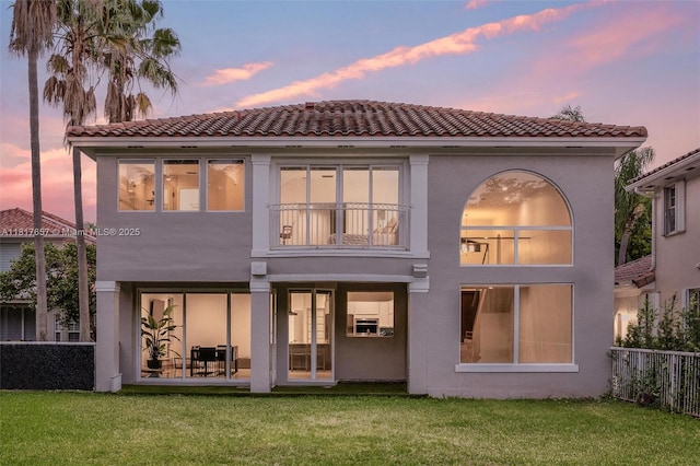 4425 NW 93rd Doral Ct, Doral, FL 33178 - back of property at dusk with stucco siding and a tile roof