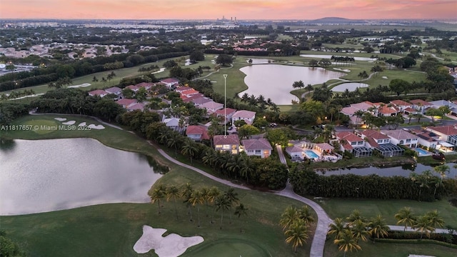 4425 NW 93rd Doral Ct, Doral, FL 33178 - aerial view at dusk of a water view, a residential view, and view of golf course