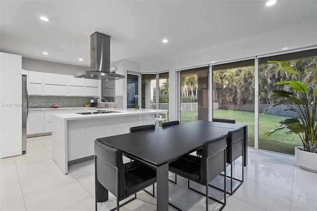 4425 NW 93rd Doral Ct, Doral, FL 33178 - kitchen featuring modern cabinets, island exhaust hood, white cabinets, light countertops, and recessed lighting