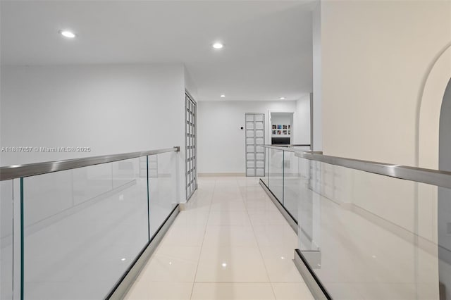 4425 NW 93rd Doral Ct, Doral, FL 33178 - hallway featuring recessed lighting, light tile patterned flooring, and baseboards