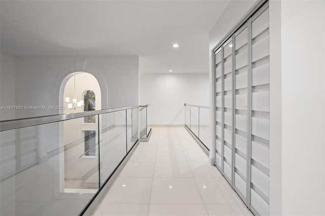 4425 NW 93rd Doral Ct, Doral, FL 33178 - corridor with recessed lighting, light tile patterned floors, and arched walkways