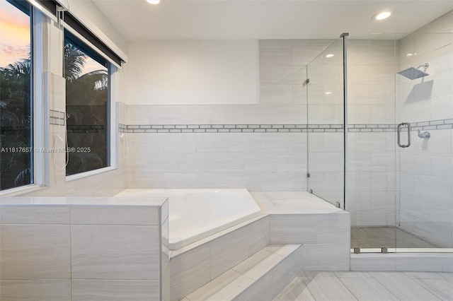 4425 NW 93rd Doral Ct, Doral, FL 33178 - full bath featuring a garden tub, recessed lighting, a stall shower, tile patterned flooring, and tile walls