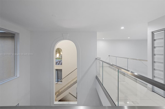 4425 NW 93rd Doral Ct, Doral, FL 33178 - hall featuring recessed lighting, arched walkways, and an upstairs landing