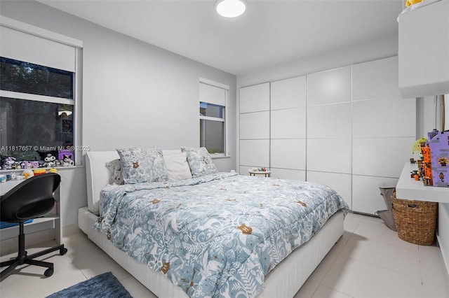 4425 NW 93rd Doral Ct, Doral, FL 33178 - bedroom featuring light tile patterned floors