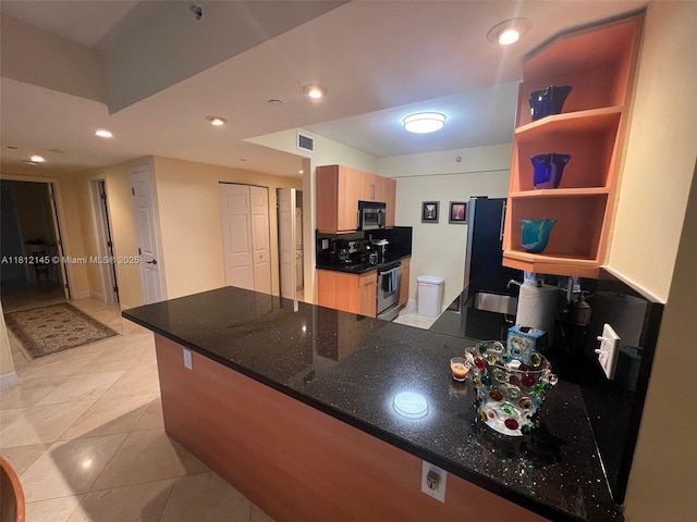 100 Lincoln Rd Unit 848, Miami Beach, FL 33139 - kitchen featuring stainless steel appliances, open shelves, a peninsula, a sink, and dark stone countertops