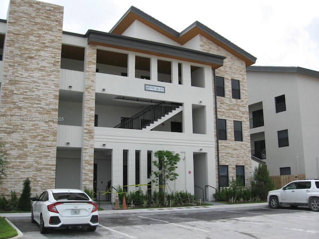 8055 NW 104th Ave Unit 32, Doral, FL 33178 - view of building exterior featuring uncovered parking