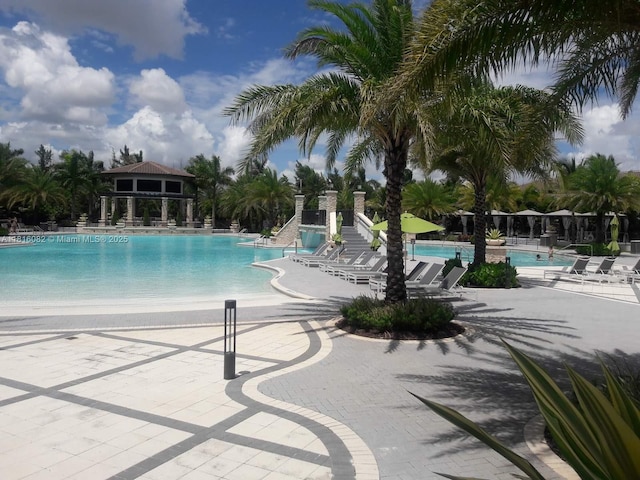 8055 NW 104th Ave Unit 32, Doral, FL 33178 - community pool with a patio area