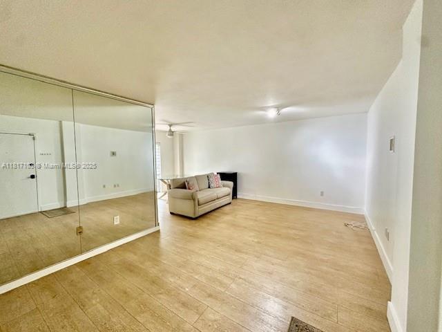 110 Salamanca Ave Unit 207, Coral Gables, FL 33134 - unfurnished room featuring light wood-style flooring and baseboards
