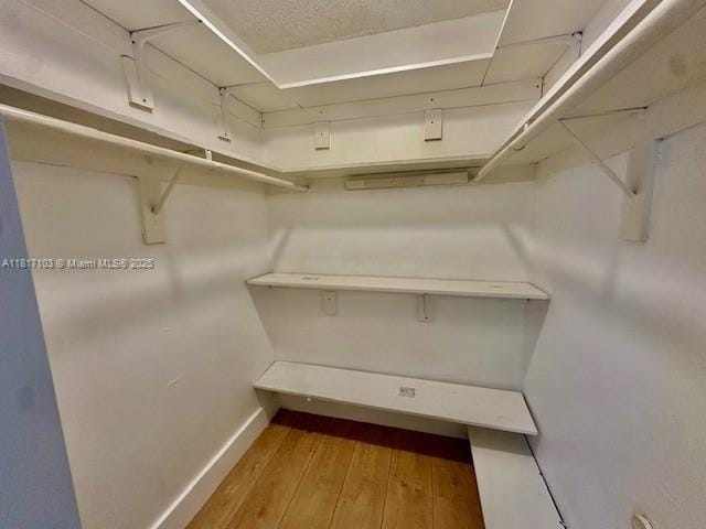 110 Salamanca Ave Unit 207, Coral Gables, FL 33134 - spacious closet with wood-type flooring
