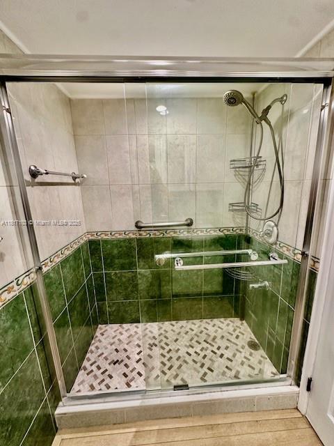 110 Salamanca Ave Unit 207, Coral Gables, FL 33134 - bathroom featuring a shower stall