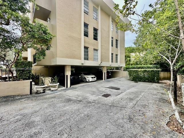 110 Salamanca Ave Unit 207, Coral Gables, FL 33134 - view of property with covered parking