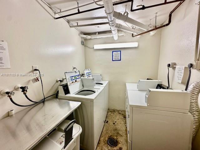 110 Salamanca Ave Unit 207, Coral Gables, FL 33134 - communal laundry room featuring separate washer and dryer