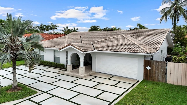 5976 SW 88th Pl, Miami, FL 33173 - mediterranean / spanish home with stucco siding, a garage, and a tiled roof