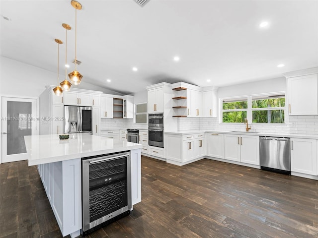 5976 SW 88th Pl, Miami, FL 33173 - kitchen featuring wine cooler, stainless steel appliances, open shelves, decorative backsplash, and recessed lighting