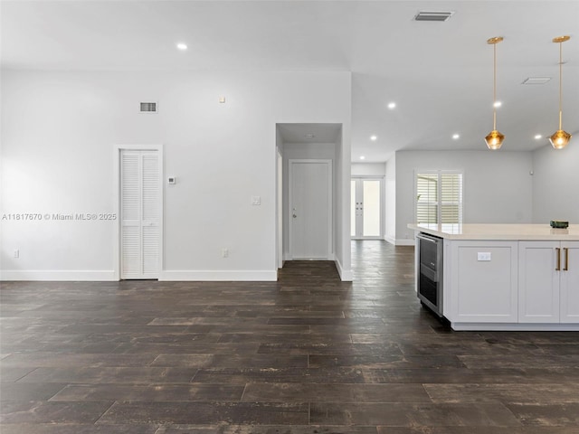 5976 SW 88th Pl, Miami, FL 33173 - kitchen featuring open floor plan, dark wood-type flooring, wine cooler, pendant lighting, and recessed lighting