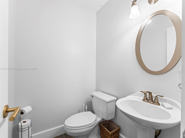 5976 SW 88th Pl, Miami, FL 33173 - half bathroom with toilet and baseboards