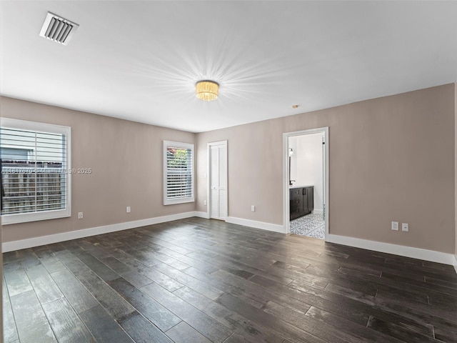 5976 SW 88th Pl, Miami, FL 33173 - spare room featuring dark wood-type flooring and baseboards