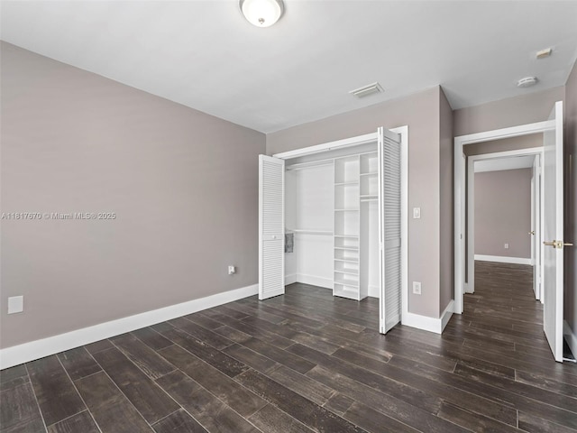 5976 SW 88th Pl, Miami, FL 33173 - unfurnished bedroom featuring dark wood-style floors and a closet
