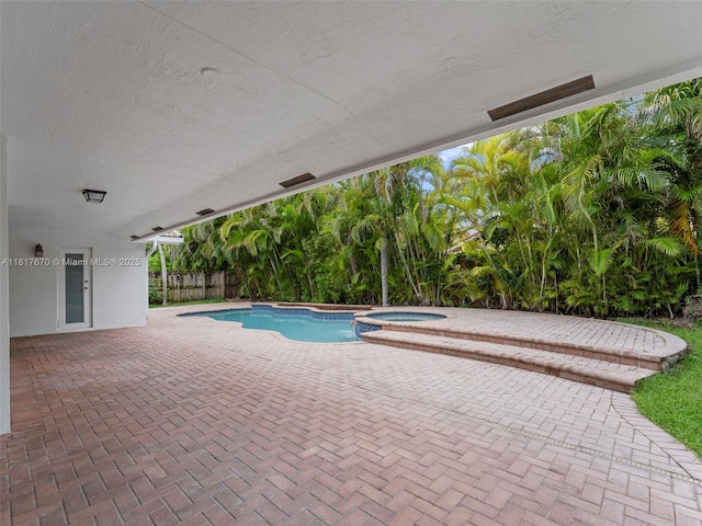 5976 SW 88th Pl, Miami, FL 33173 - view of swimming pool with a patio and a pool with connected hot tub