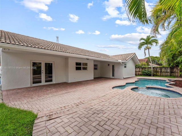 5976 SW 88th Pl, Miami, FL 33173 - view of pool featuring french doors, a patio, and a pool with connected hot tub