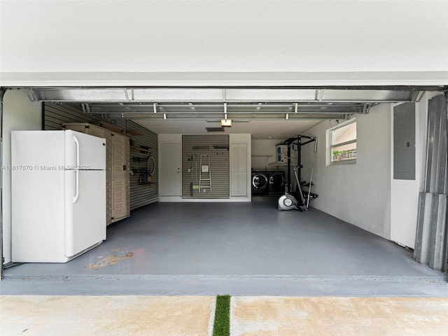 5976 SW 88th Pl, Miami, FL 33173 - garage featuring freestanding refrigerator, separate washer and dryer, and electric panel