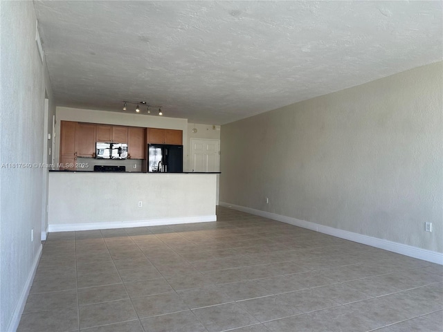 10350 W Bay Harbor Dr Unit 4F, Bay Harbor Islands, FL 33154 - unfurnished living room with light tile patterned floors, a textured ceiling, and track lighting