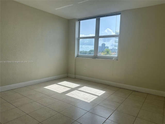 10350 W Bay Harbor Dr Unit 4F, Bay Harbor Islands, FL 33154 - unfurnished room with light tile patterned flooring and baseboards