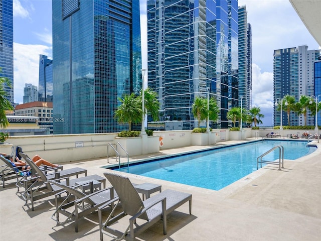 1200 Brickell Bay Dr Unit 2112, Miami, FL 33131 - community pool featuring a patio and a view of city