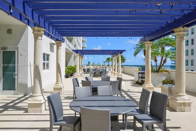 1200 Brickell Bay Dr Unit 2112, Miami, FL 33131 - view of patio with outdoor dining area and a pergola