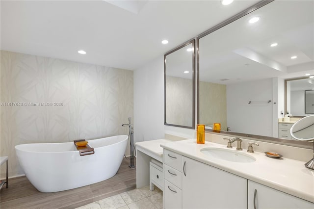 1331 Brickell Bay Dr Unit 4001, Miami, FL 33131 - full bath featuring vanity, a freestanding bath, recessed lighting, and wallpapered walls