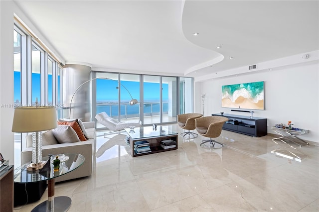 1331 Brickell Bay Dr Unit 4001, Miami, FL 33131 - living room featuring expansive windows, marble tiled flooring, a water view, and recessed lighting
