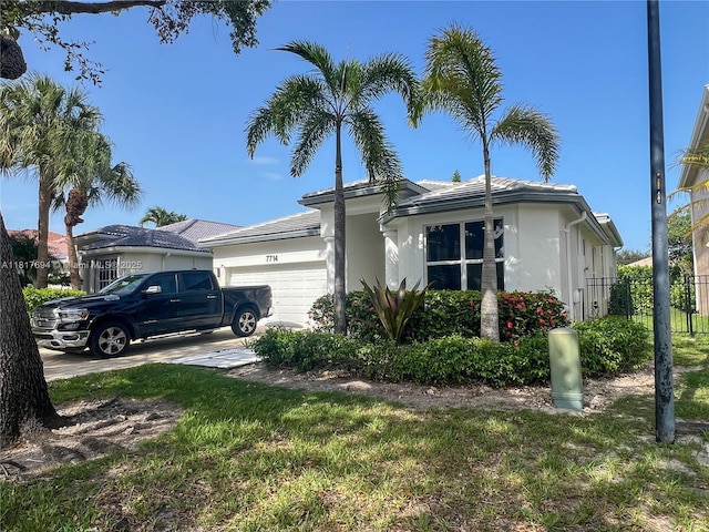 7714 NW 70th Way, Parkland, FL 33067 - view of side of home with an attached garage and stucco siding