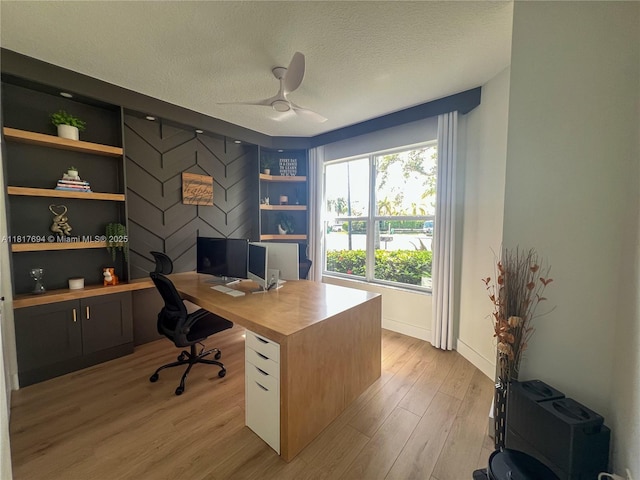 7714 NW 70th Way, Parkland, FL 33067 - home office with ceiling fan, a textured ceiling, and light wood finished floors