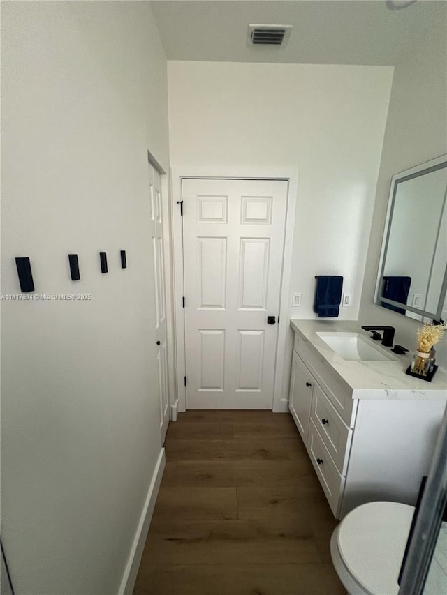 7714 NW 70th Way, Parkland, FL 33067 - bathroom with wood finished floors and vanity