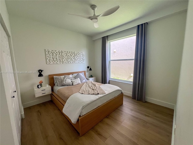 7714 NW 70th Way, Parkland, FL 33067 - bedroom with wood finished floors and a ceiling fan