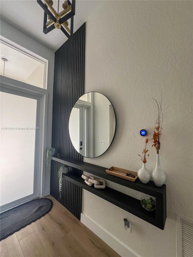 7714 NW 70th Way, Parkland, FL 33067 - bathroom with wood finished floors and a chandelier