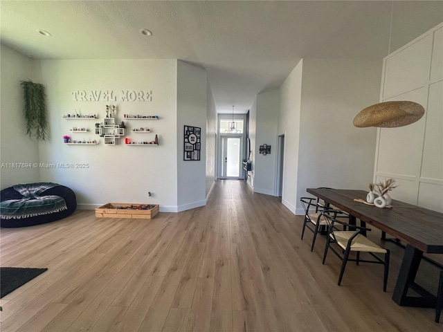 7714 NW 70th Way, Parkland, FL 33067 - hall with light wood-style floors and baseboards