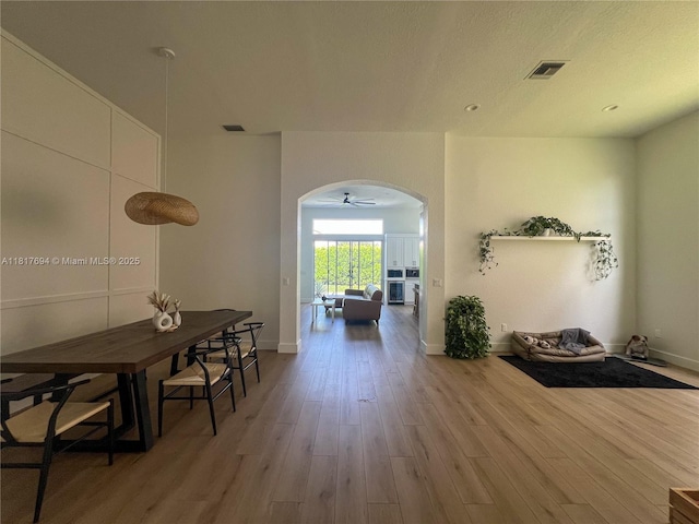 7714 NW 70th Way, Parkland, FL 33067 - corridor with arched walkways and wood finished floors