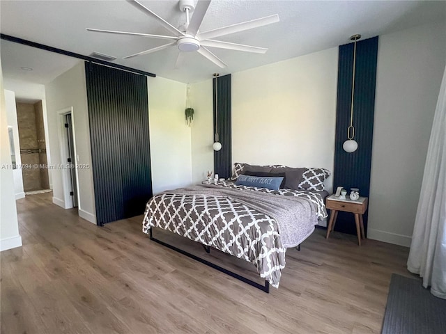 7714 NW 70th Way, Parkland, FL 33067 - bedroom featuring wood finished floors and a ceiling fan