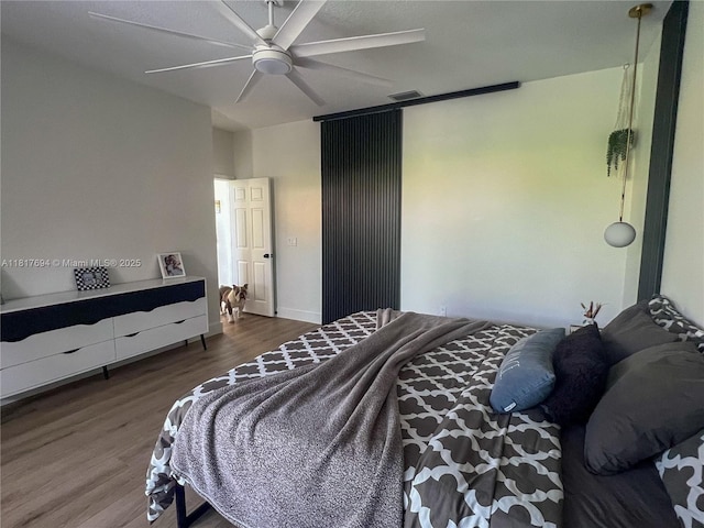 7714 NW 70th Way, Parkland, FL 33067 - bedroom featuring wood finished floors and a ceiling fan
