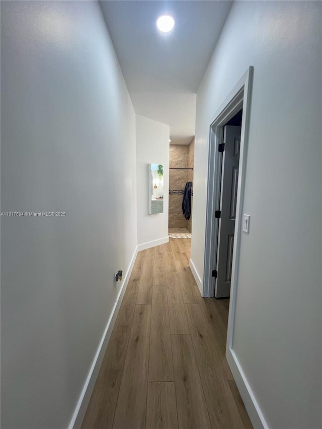7714 NW 70th Way, Parkland, FL 33067 - corridor featuring wood finished floors and baseboards