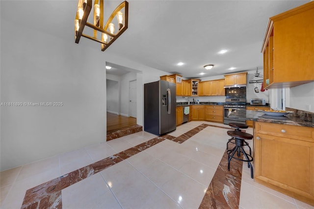 81 Hough Dr, Miami Springs, FL 33166 - kitchen featuring appliances with stainless steel finishes, glass insert cabinets, light tile patterned flooring, recessed lighting, and pendant lighting