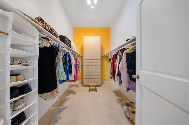 81 Hough Dr, Miami Springs, FL 33166 - walk in closet with light tile patterned floors