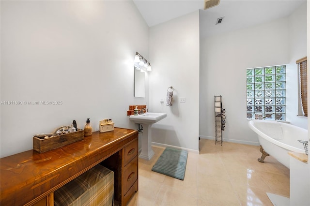 81 Hough Dr, Miami Springs, FL 33166 - full bath with high vaulted ceiling, a soaking tub, and tile patterned flooring