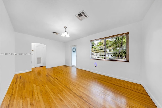 81 Hough Dr, Miami Springs, FL 33166 - unfurnished room with a chandelier and light wood-type flooring