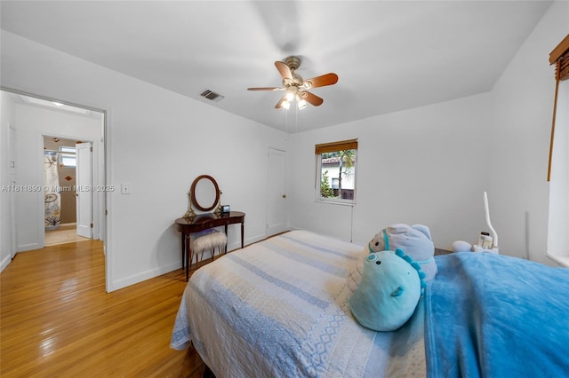 81 Hough Dr, Miami Springs, FL 33166 - bedroom with light wood-style floors and ceiling fan