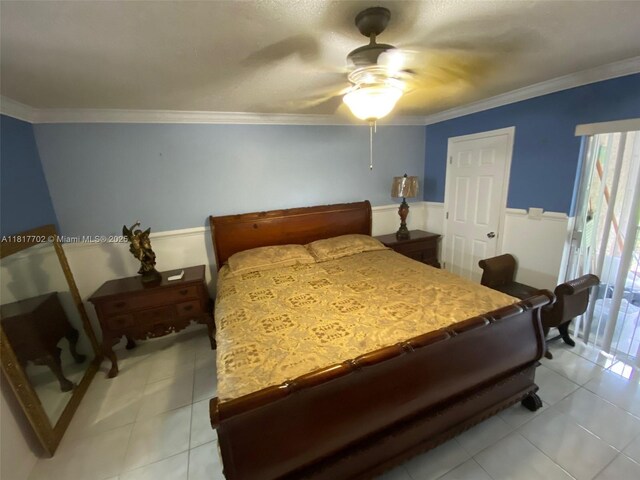 6200 NW 44th St Unit 115, Lauderhill, FL 33319 - bedroom with light tile patterned floors, ornamental molding, a ceiling fan, and wainscoting