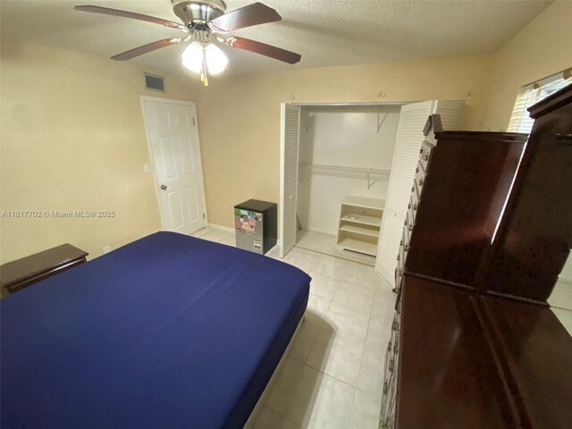 6200 NW 44th St Unit 115, Lauderhill, FL 33319 - unfurnished bedroom featuring a ceiling fan, tile patterned floors, and a textured ceiling